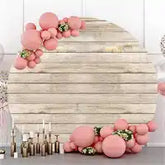 Circular balloon arch with pink balloons and gold accents.